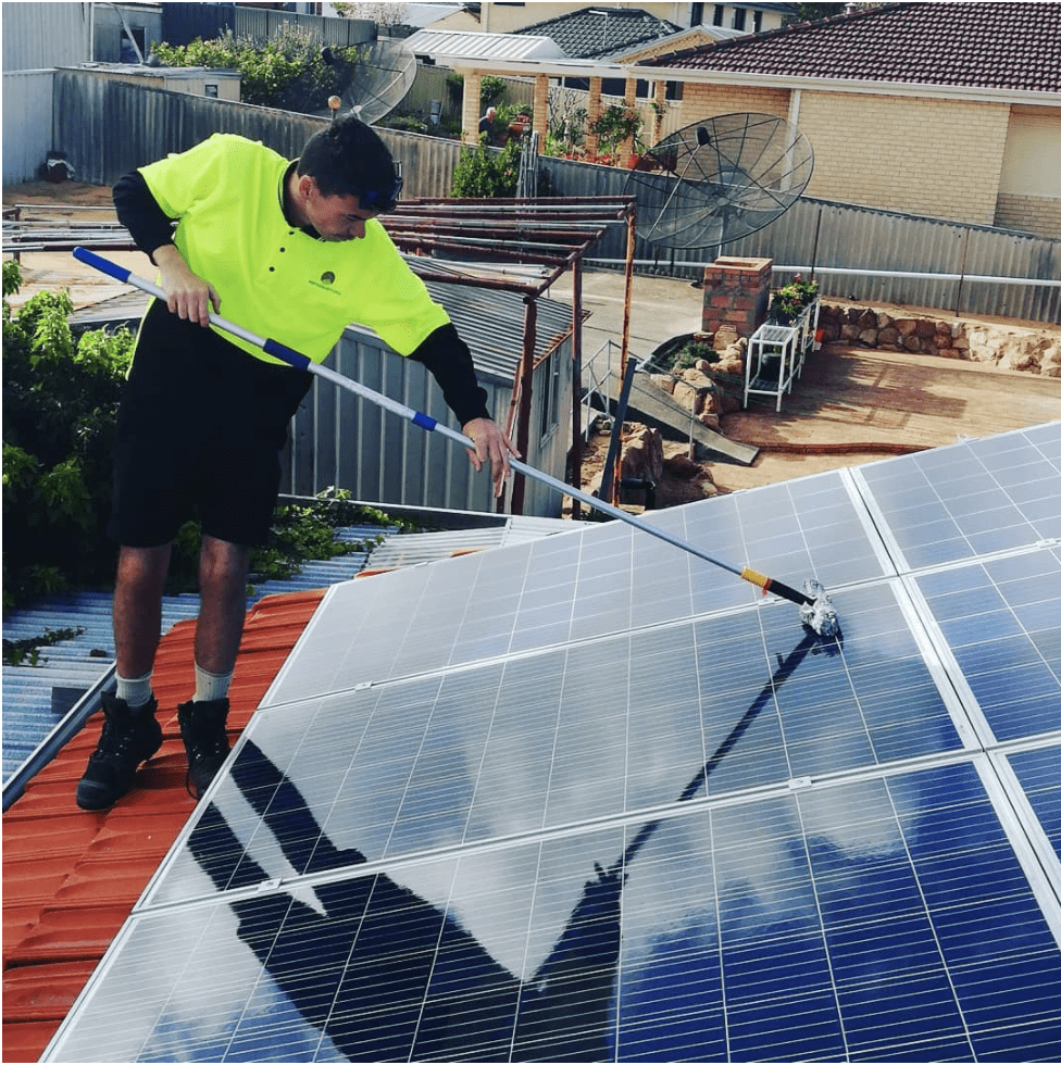 Cleaning solar panels on roof